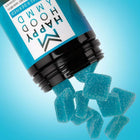 Gummies bleus Happy Mood Blueberry Lemonade tombant d’un flacon renversé, 50mg CBD et 10mg THC